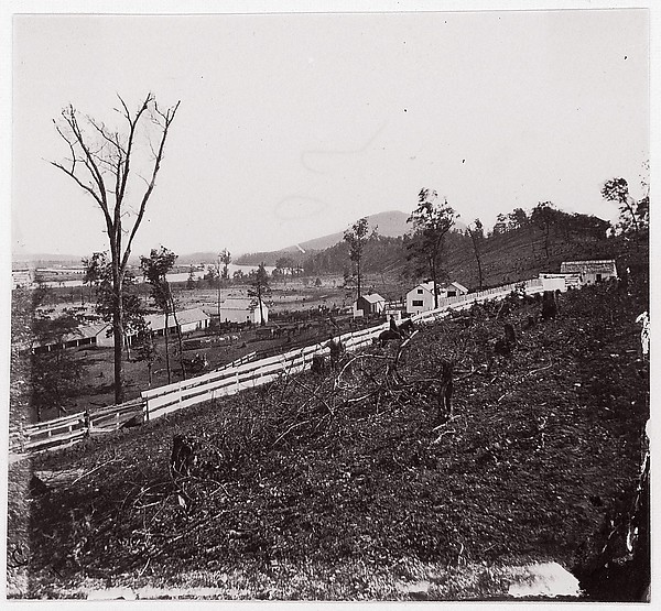 [White picket fence with buildings in background].  Brady album, p. 123